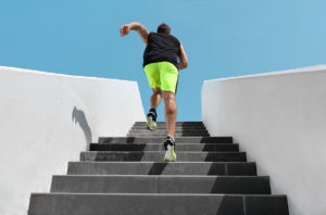 Athletic man exercising on outdoor stairway