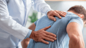 Chiropractor providing spinal adjustment for musculoskeletal discomfort.