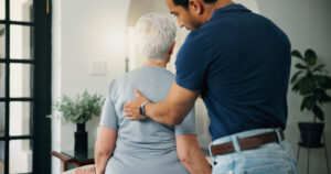 Patient consultation with chiropractor discussing joint pain before spinal adjustment in NJ office.