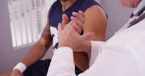 Orthopedic specialist evaluating a soccer athlete
