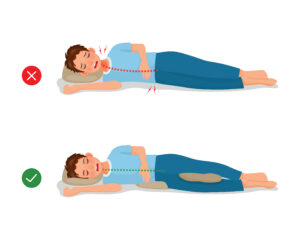 Adult side sleeper using a pillow between the knees to support knee, hip, and spinal alignment